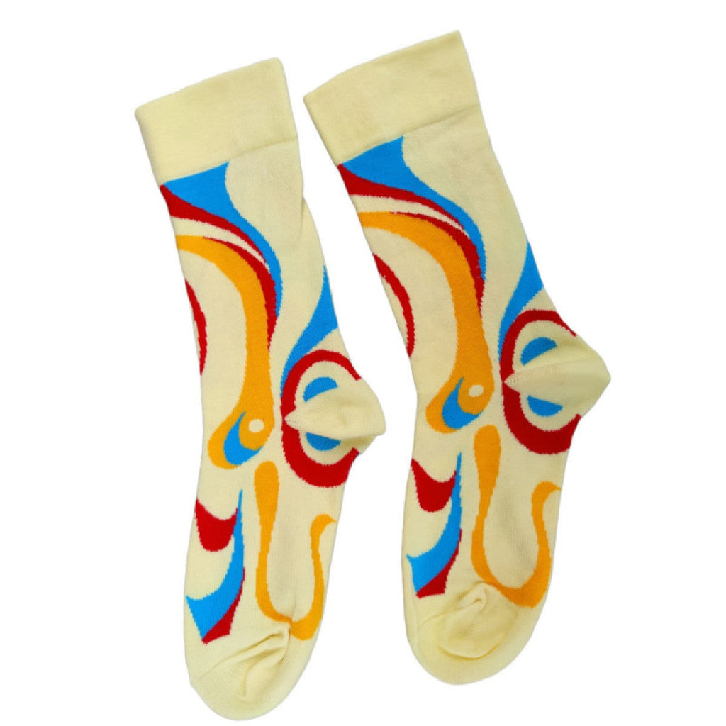 Pale yellow bamboo socks with blue red and orange swirl pattern, size 7-11